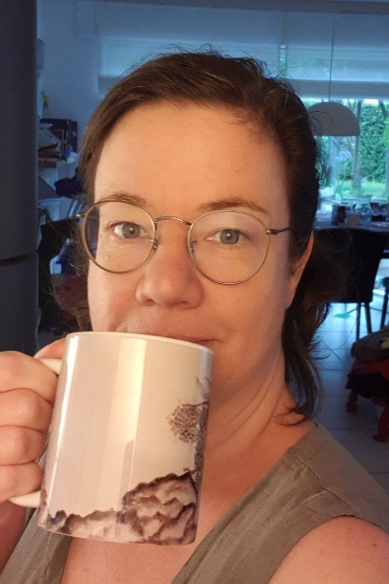 me drinking coffee in my drupalcon living room