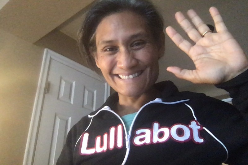 Monica wearing Lullabot jacket and waving hello