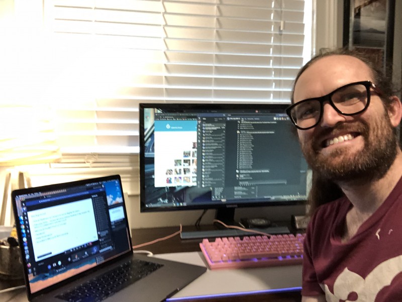 Eric Sembrat selfie in front of his computer