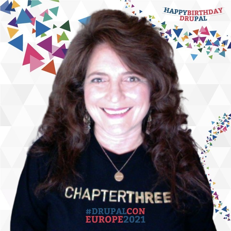 Joans headshot wearing black Chapter Three t-shirt with gold lettering, #DrupalCON Europe 2021 background, wishing Drupal a Happy Birthday!