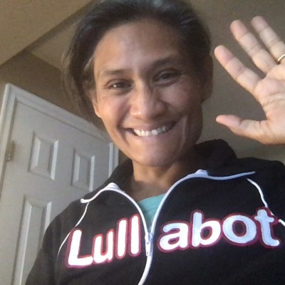 Monica wearing Lullabot jacket and waving hello