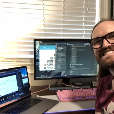 Eric Sembrat selfie in front of his computer